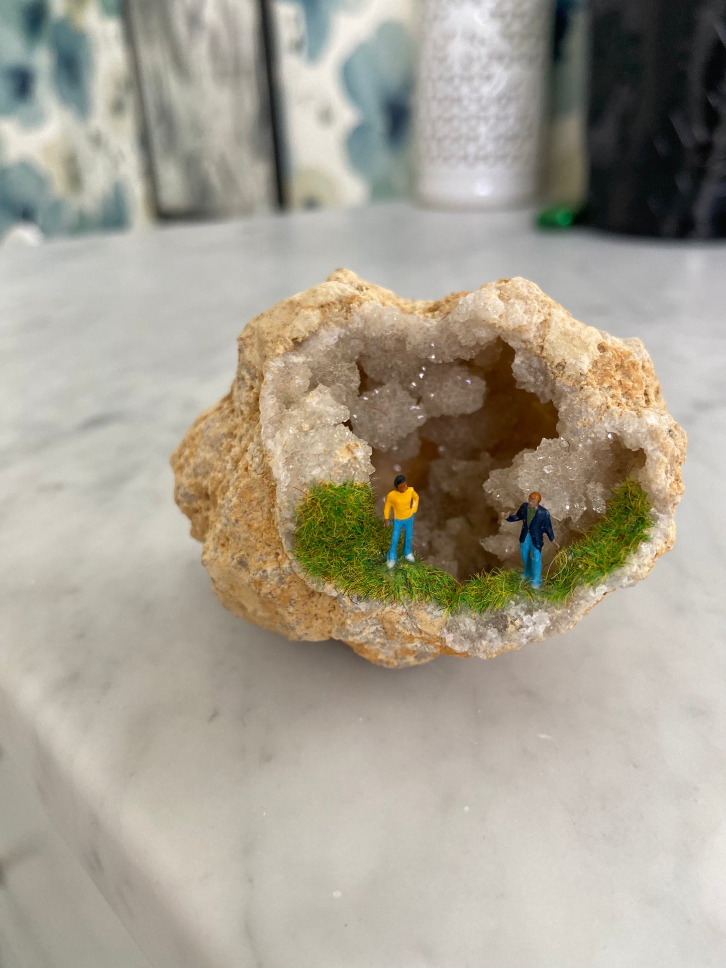 Geode Art piece w/ tiny people at “crystal cave entrance”