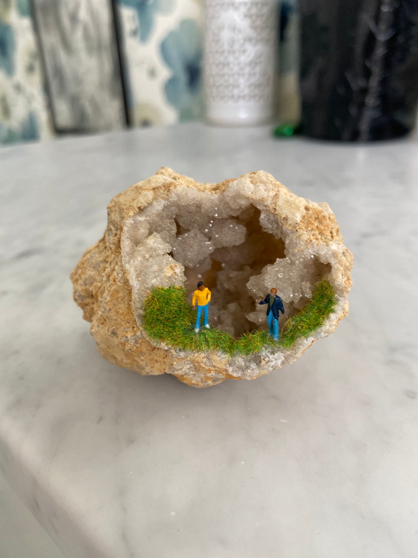 Geode Art piece w/ tiny people at “crystal cave entrance”