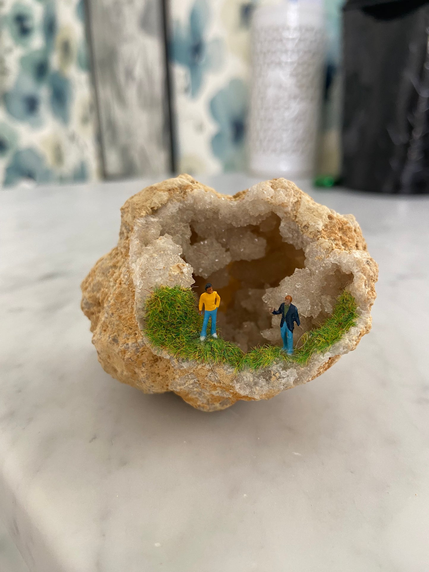 Geode Art piece w/ tiny people at “crystal cave entrance”