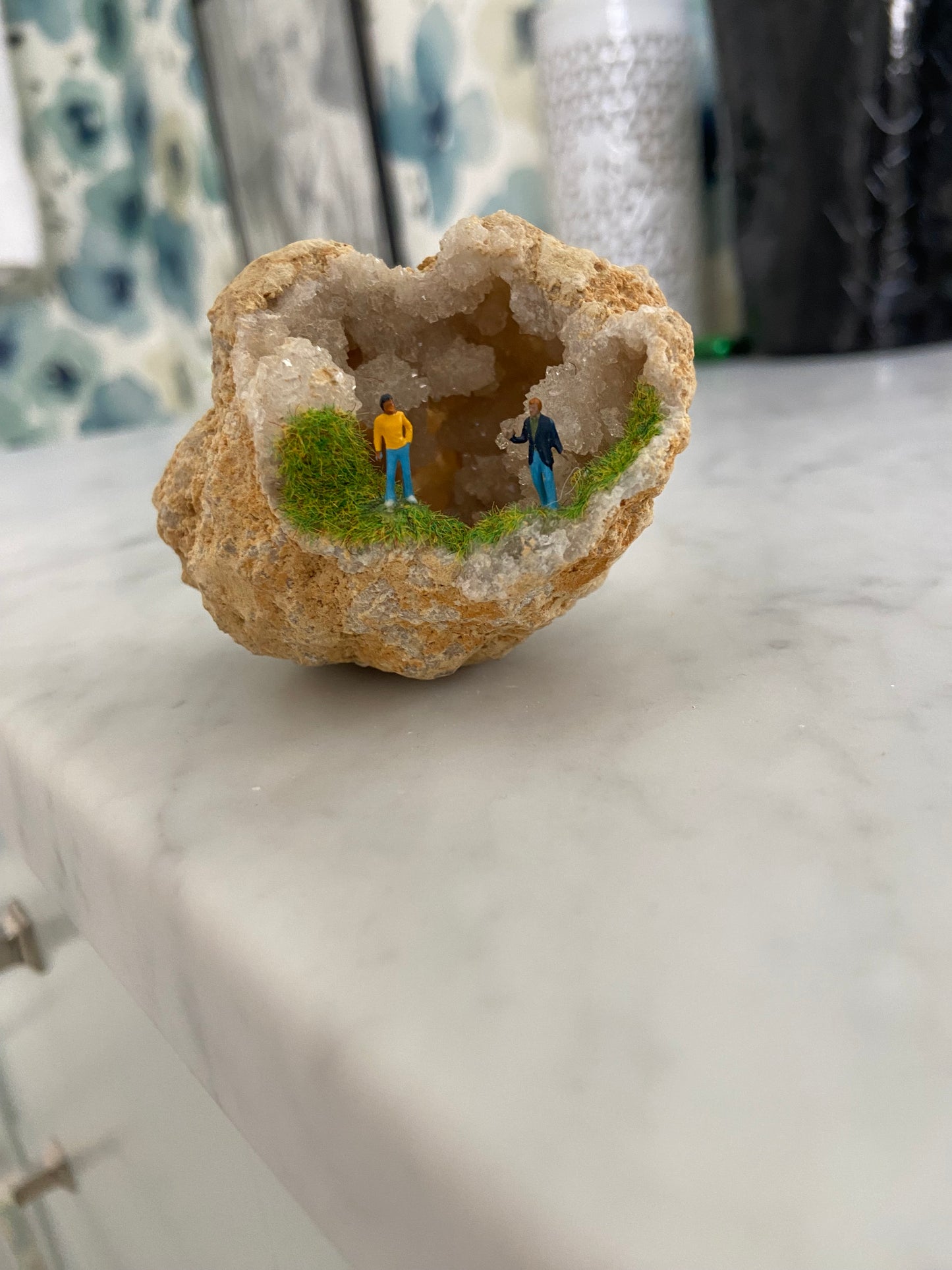 Geode Art piece w/ tiny people at “crystal cave entrance”